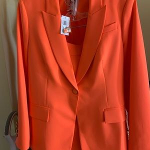 Vibrant orange suit, size 10 brand new